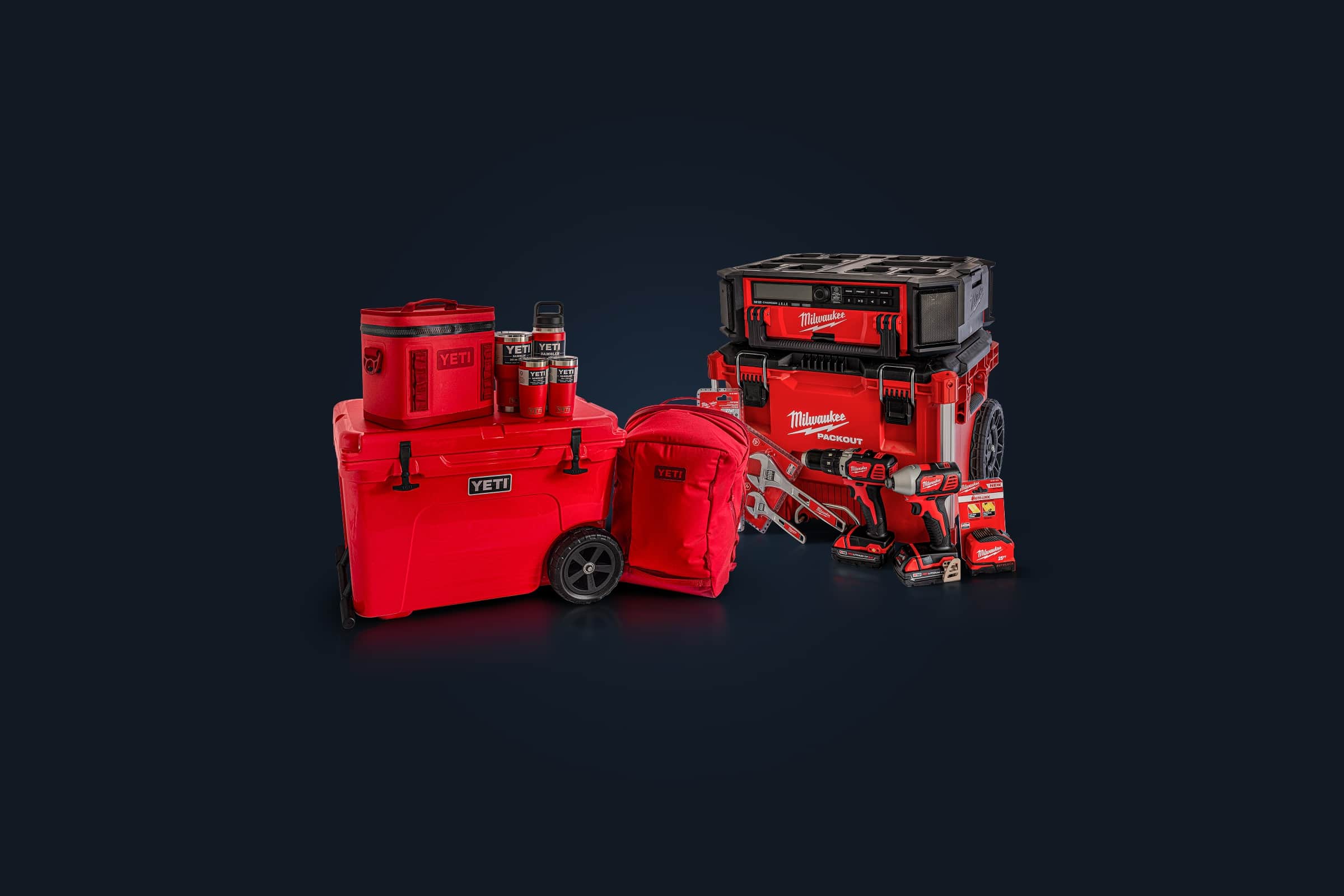 The two prize packs: a red YETI bundle with a wheeled cooler, soft cooler, backpack and tumblers, and a Milwaukee PACKOUT bundle with a radio, tool box, drill, impact driver, wrenches and tape measure.